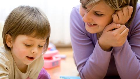 preschool child talking with mother